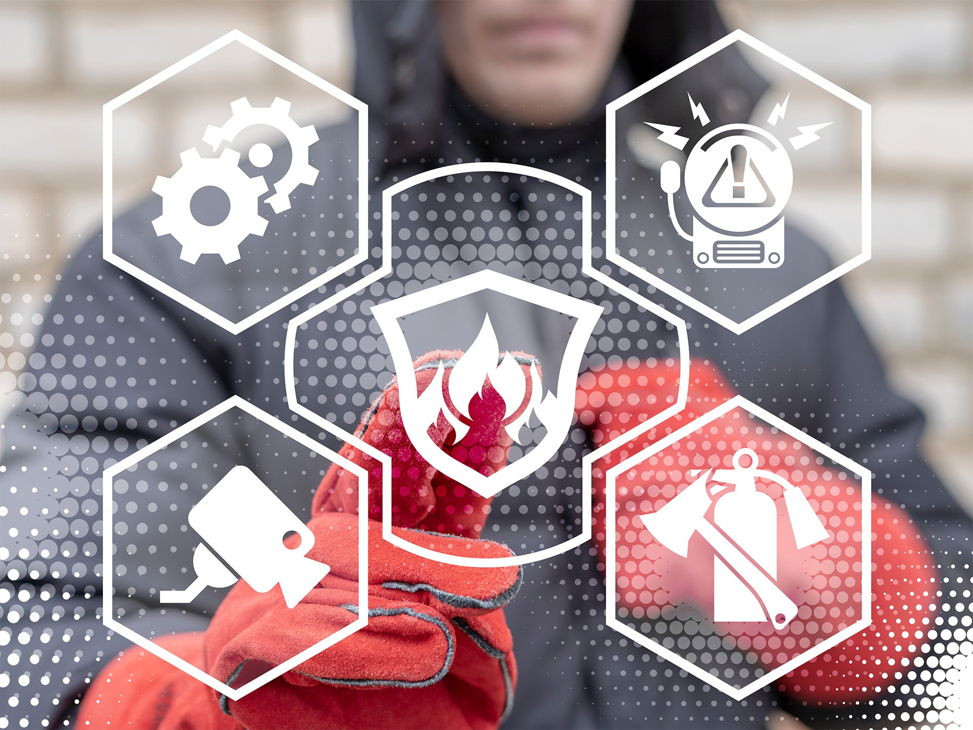 Konzeptfoto für Brandschutz und Sicherheit in Betrieben – Ingenieur bedient Touchscreen mit verschiedenen Icons zum Thema Brandschutz